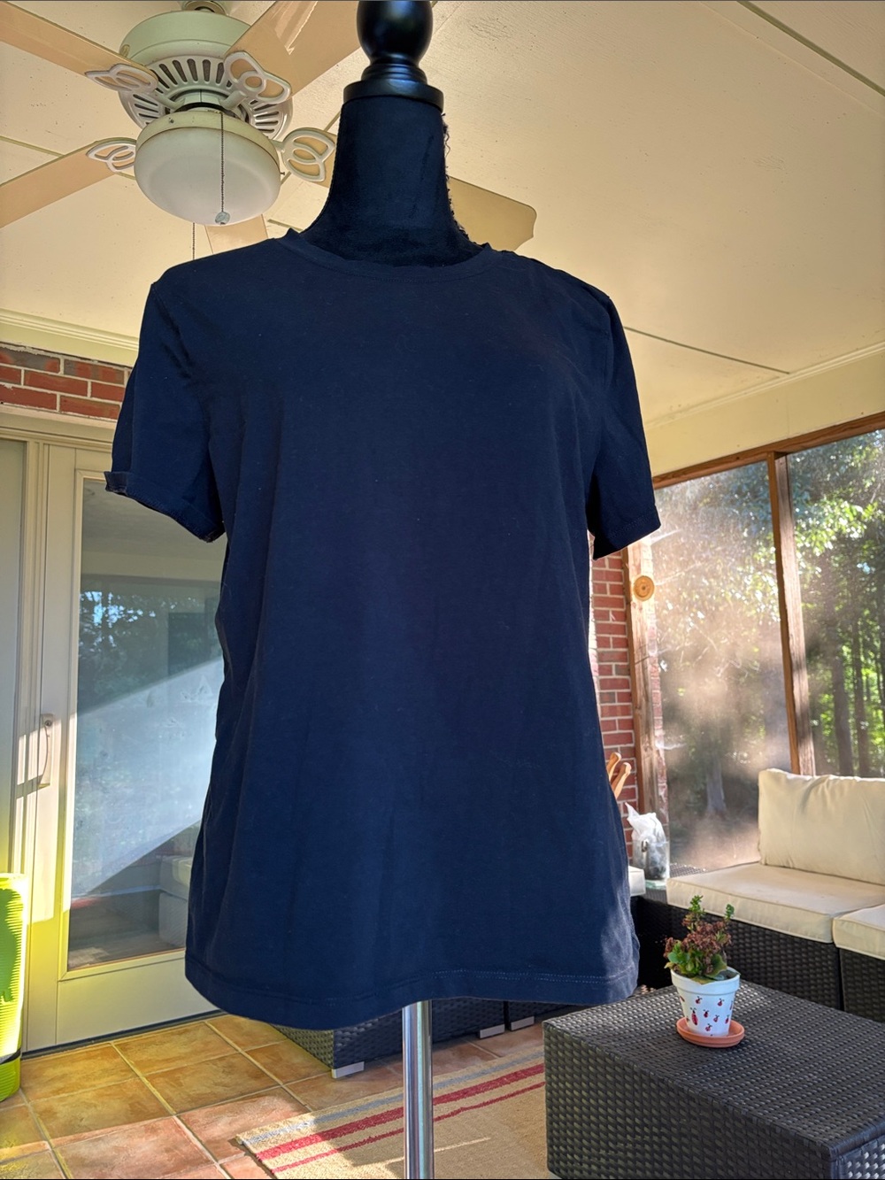 A New Day black tee